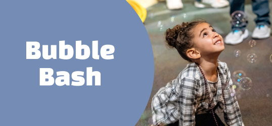 kid looking up at bubbles