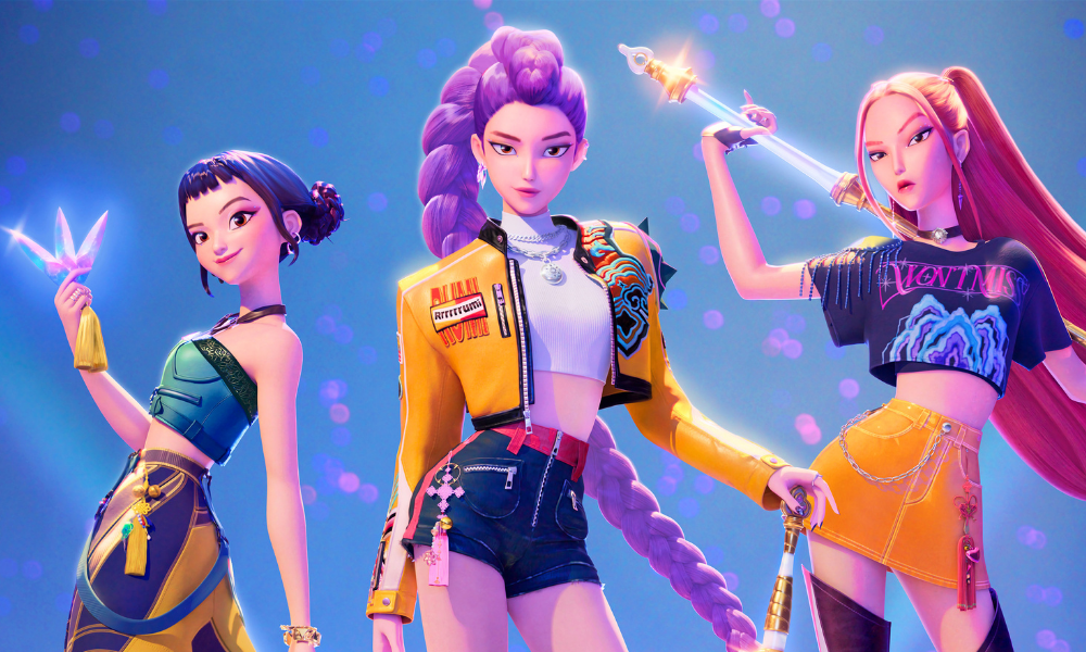 The three animated characters of Huntrix stand looking awesome before a light blue background.